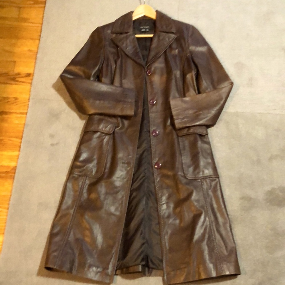 Brown leather Zara woman’s long line jacket.